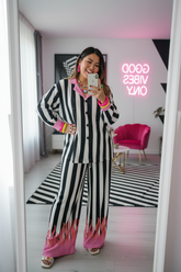 Asian woman in striped set with chic modern background