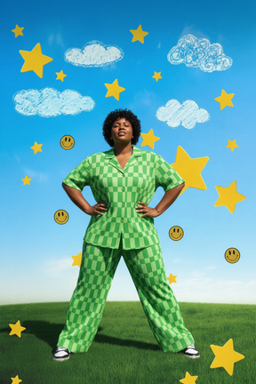 Plus-size Black woman power pose in green checkered pant set