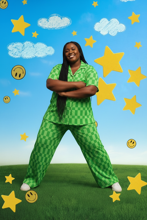 Plus-size Black woman with braids in green checkered set